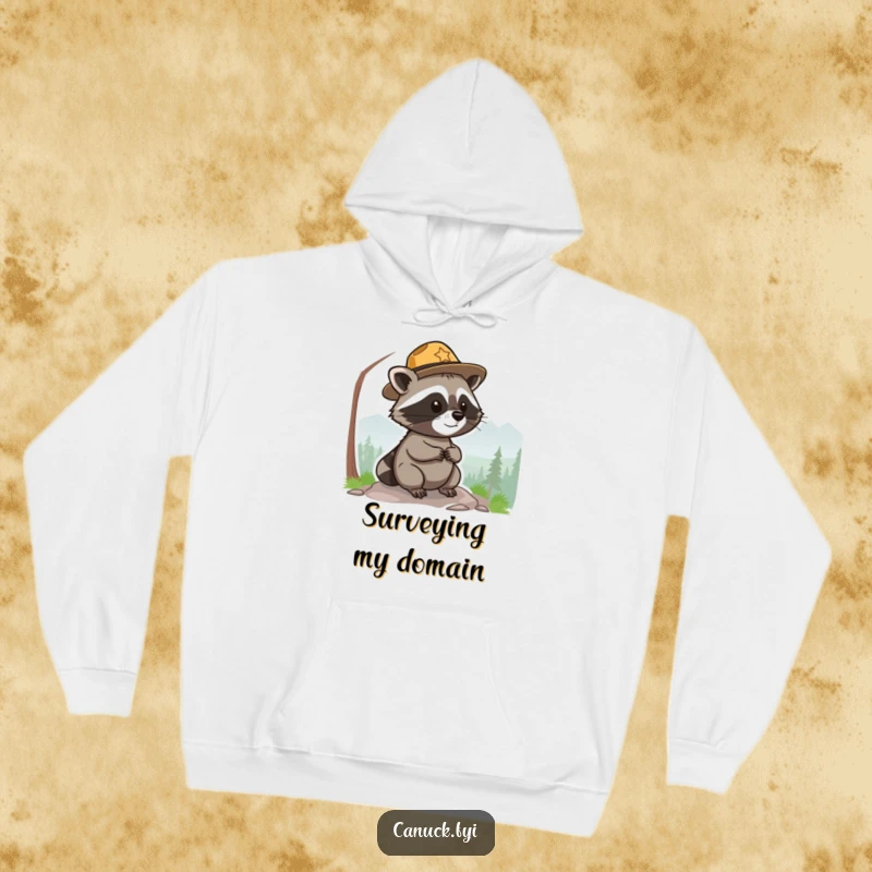 Funny park ranger raccoon hoodie, small, round, wearing a hat, surveying a scenic view, warm and humorous.